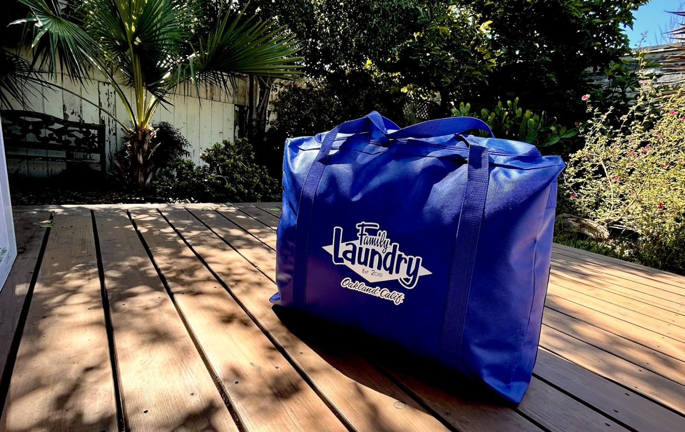 A zipped Family Laundry bag waiting on a sunny deck