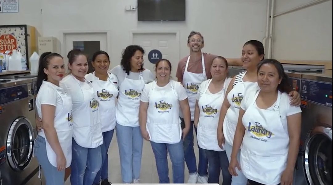 The Family Laundry team in aprons at the Oakland facility